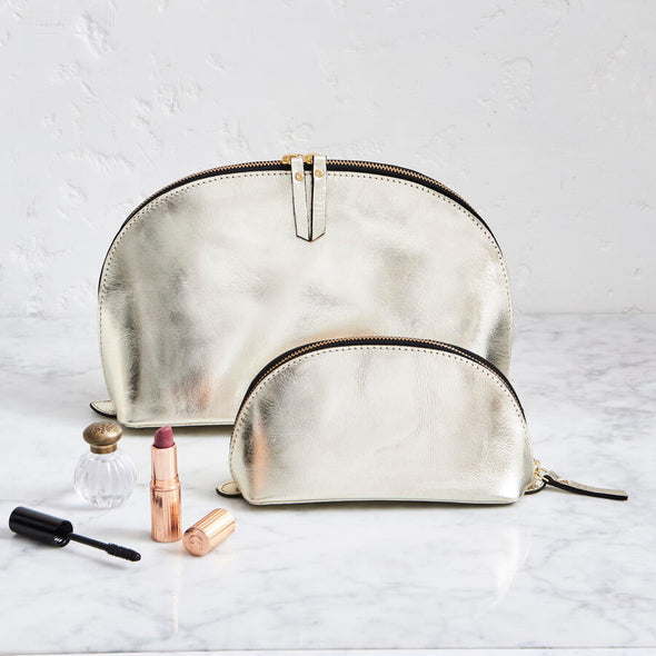 Metalic gold make up and wash bag set in leather