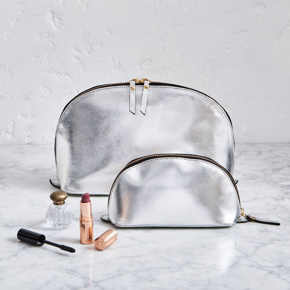 Metalic silver makeup and was bag in leather