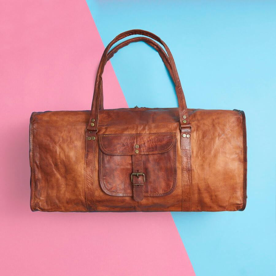 large vintage brown leather duffel bag with handles and outside pocket