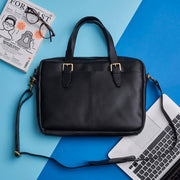 Black leather laptop bag with handle and strap