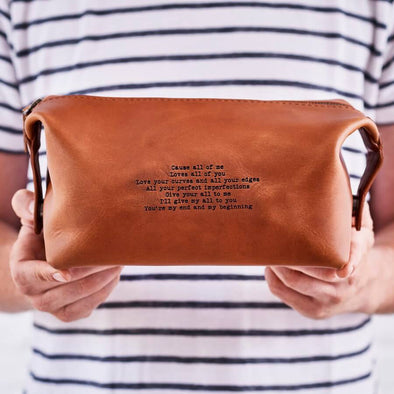 Leather washbag personalised with song lyrics