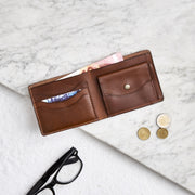 Raw tan leather wallet with coin slot