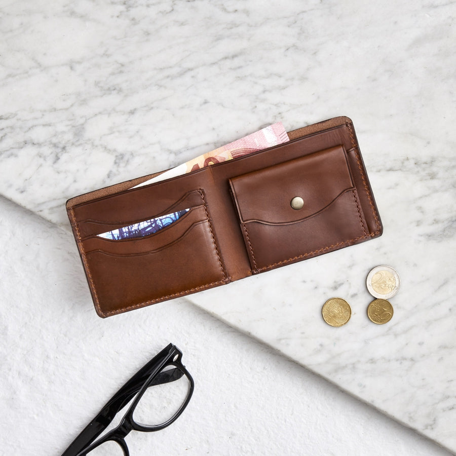 Raw tan leather wallet with coin slot