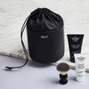 Black leather drawstring wash bag with initials