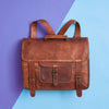Convertible tan leather backpack and satchel flat layout