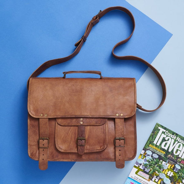 Styled view of tan leather special laptop bag