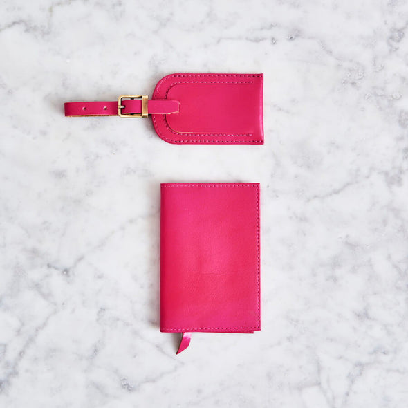 Pink passport cover and luggage tag in leather