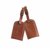 Tan leather luggage tags embossed
