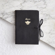 Black embossed leather notebook