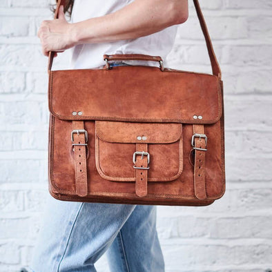 Leather satchel with front pocket and handle