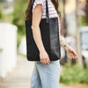 Vertical ladies tote bag in leather and canvas in black