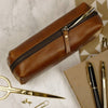 Tan leather pencil case present