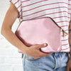 Metalic pink leather clutch bag with embossing