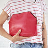 Pink leather clutch bag with personal message