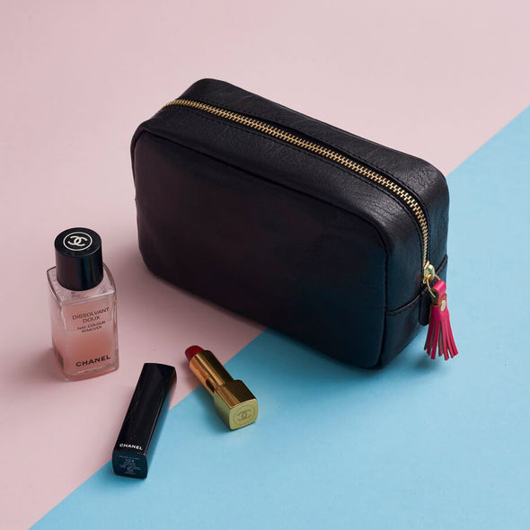Black leather with pink tassel makeup bag
