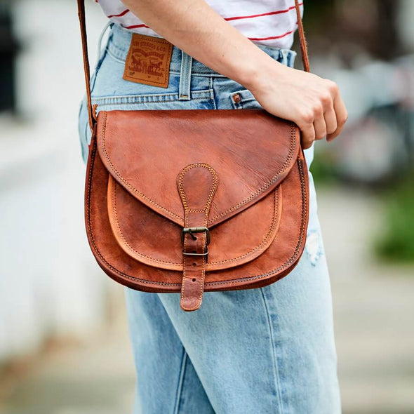 Ladies medium size leather shoulder saddle bag in tan